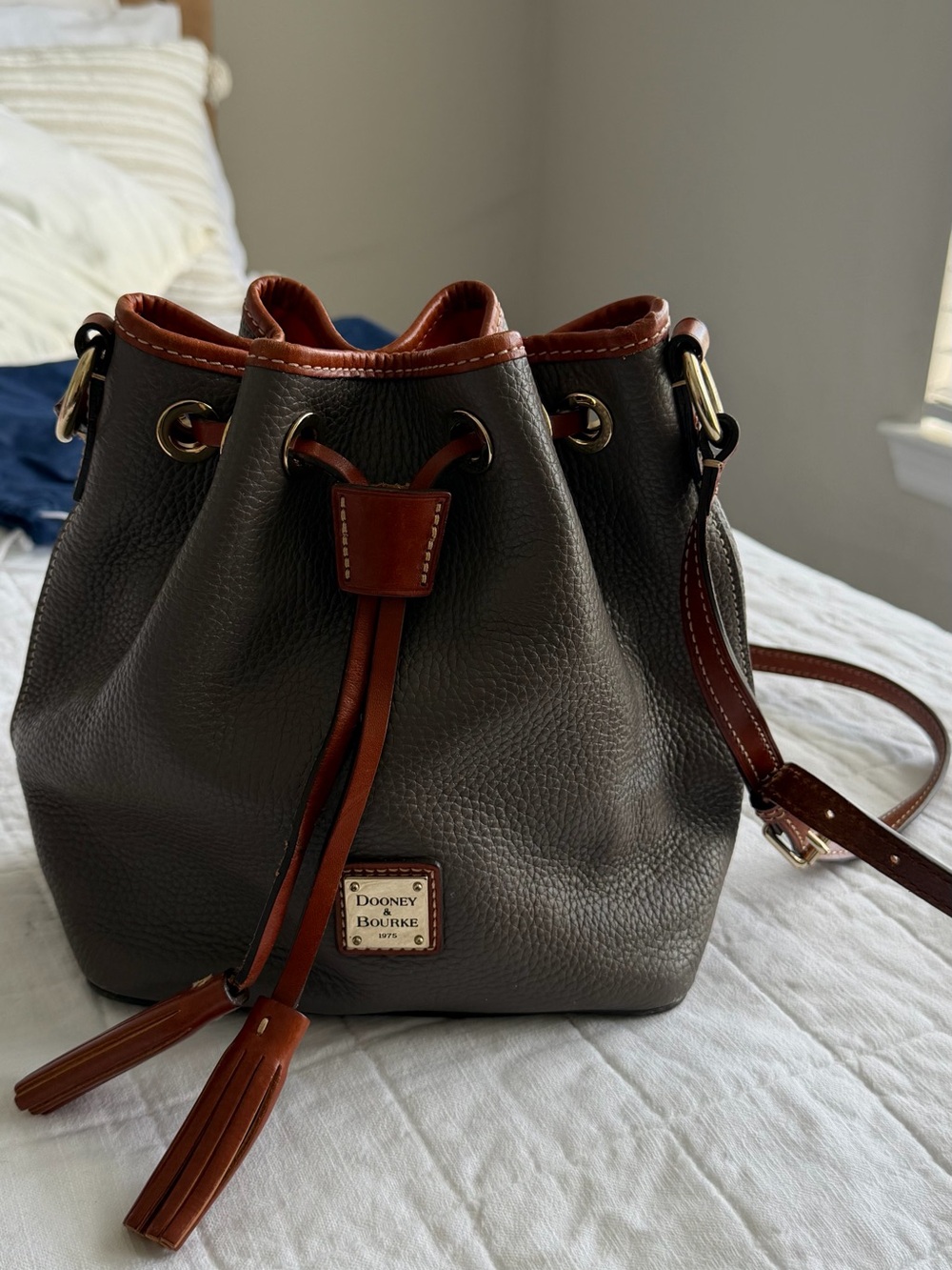 Dooney & Bourke Gray Pebbled Leather Bucket Crossbody with Brown Trim